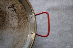 Empty steel paella pan